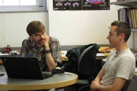 Ethan Garvey '19 discussing dark matter research with Prof. Thomas